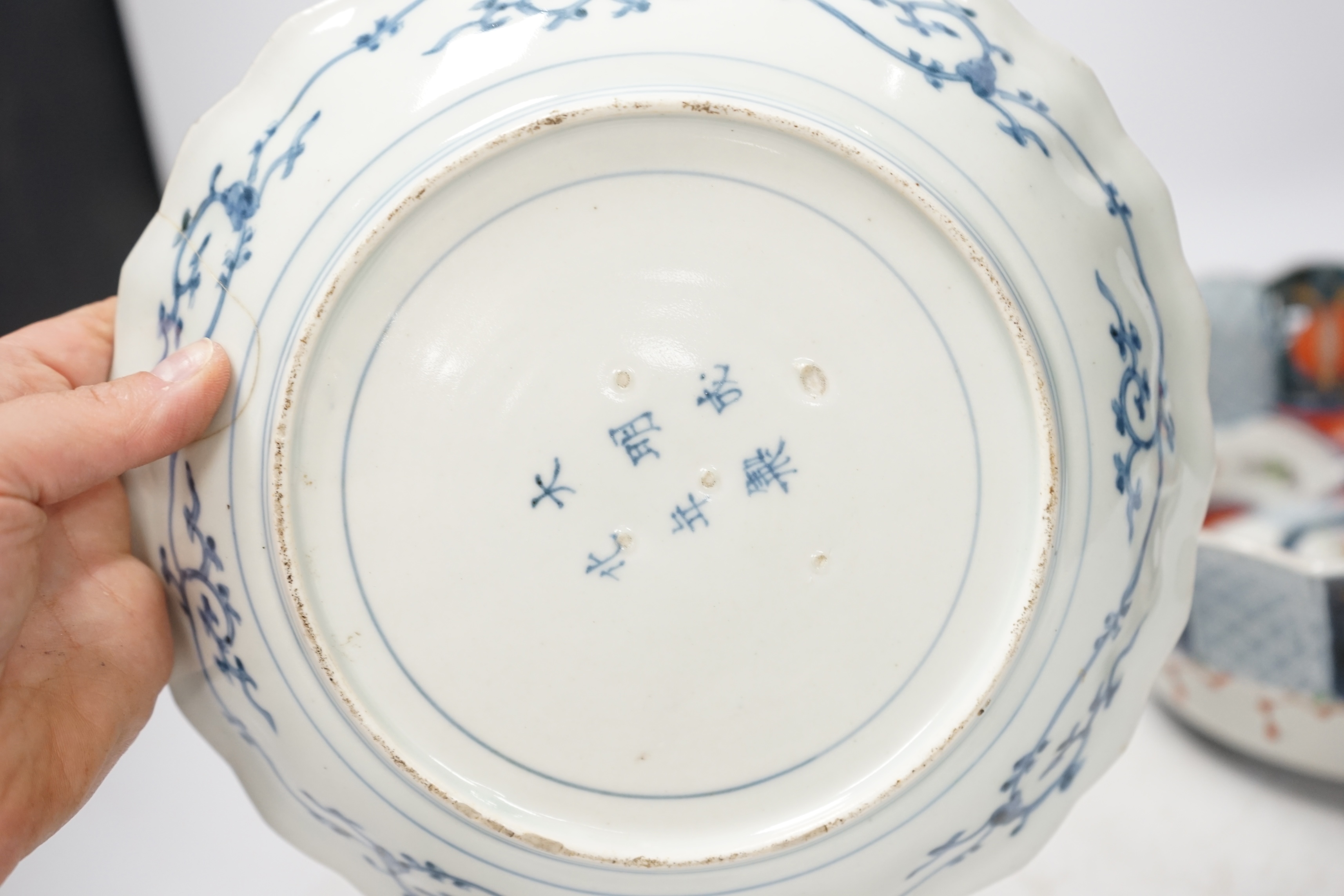 Japanese ceramics to include an Imari vase and bowl and a blue and white dish, 22cm diameter. Condition - two bowls and dish good, others poor